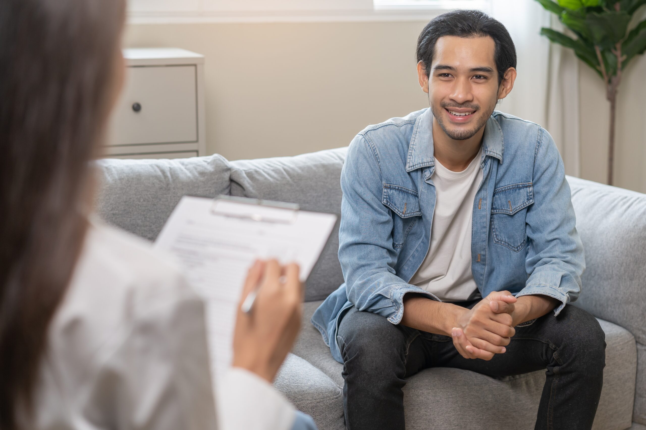 Young man meets with mental health therapist to address stress